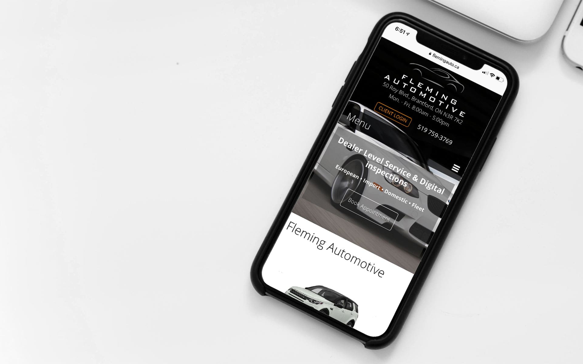 Fleming Automotive web site displayed on an iPhone.