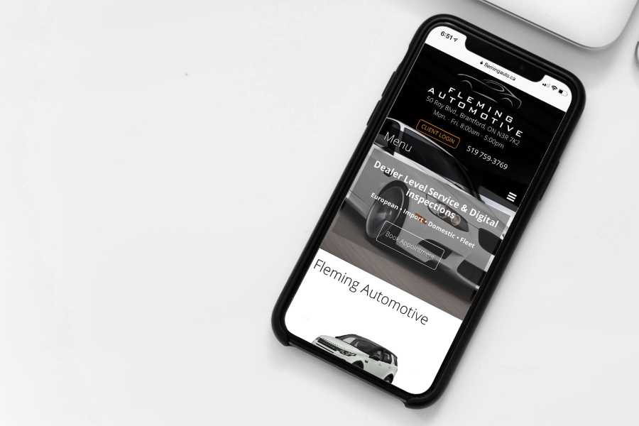 Fleming Automotive web site displayed on an iPhone.