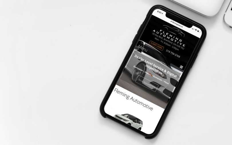 Fleming Automotive web site displayed on an iPhone.