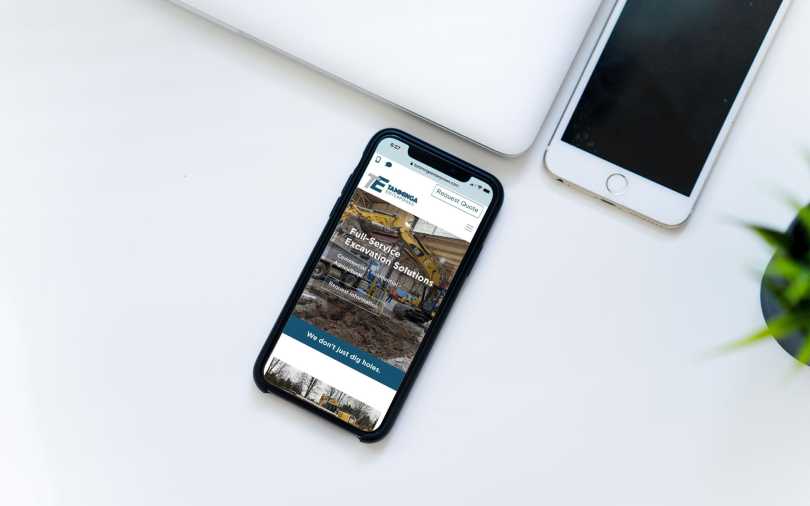 Mock-up of the new Tamminga Enterprises web site design on an iPhone.