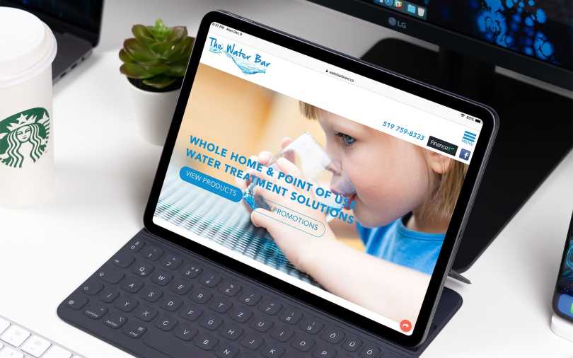 Web design mock-up of The Water Bar website showing layout on iPad.