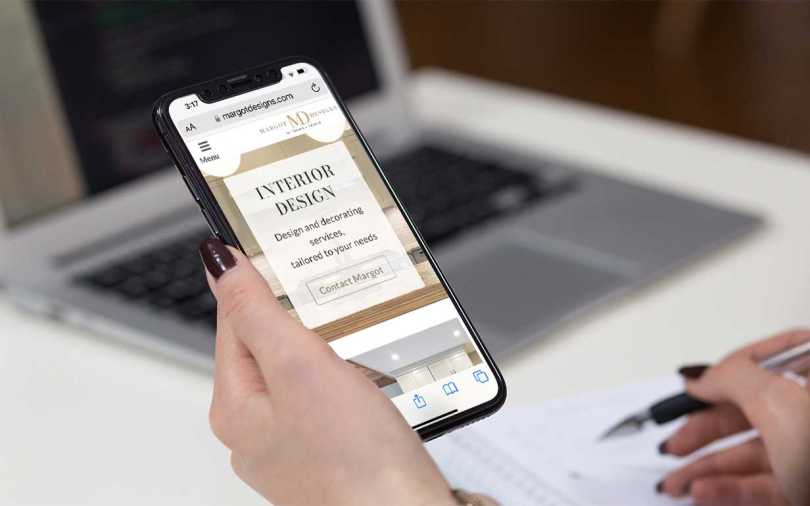 Margot Designs web site home page displayed on an iPhone.